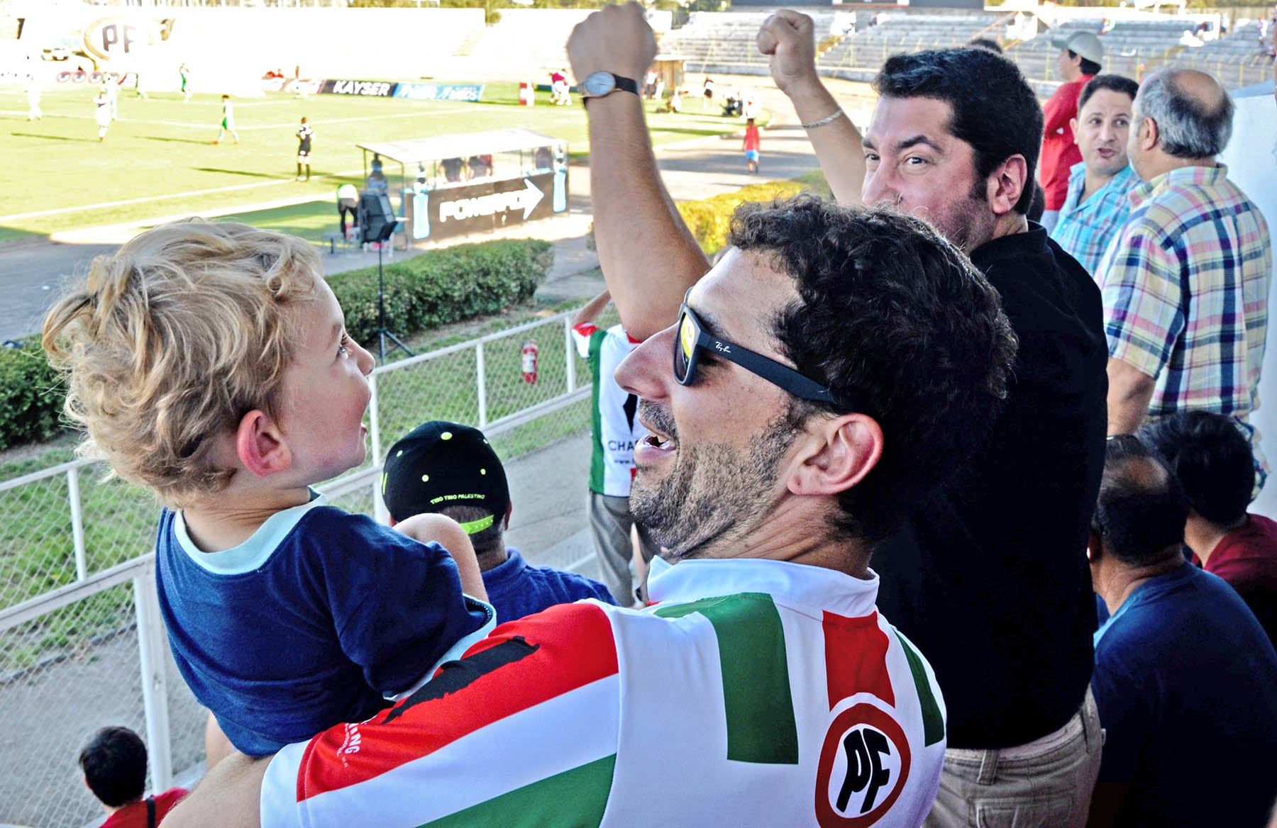 A Palestino fan shares the game with his son, reinforcing ties across generations with a global diaspora&nbsp;and&nbsp;land of origin half a world&nbsp;away.