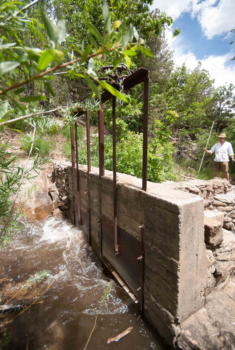 This modern concrete acequia headgate controls the ﬂow of water into ﬁelds through multiple &ldquo;doors.&rdquo; The local mayordomo decides how to share the water channeled from rivers and streams.