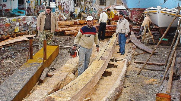 Saw in hand, lead shipwright Khaled Hammoud shaped timbers for Phoenicia in Arwad, Syria, in 2007. 