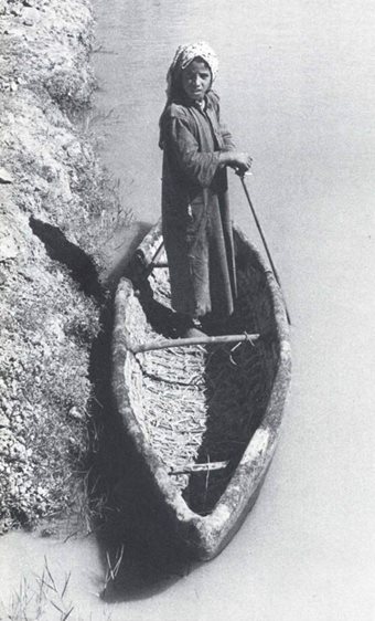 "In the Marshes children often fashioned small rafts from bundles of bulrushes, sometimes turning up the end for a prow, and paddled about the villages on these primitive craft. I once saw an interesting type of coracle, called a zaima, on a branch of the Euphrates below Suq ash-Shyukh. Made of qasab (giant reeds) and coated outside with bitumen, it teas ten feet long and two and a half feet at its widest. 