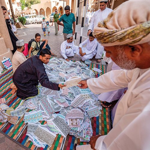 A shop in Muscat sells kummahs wrapped within an embrodiered woolen cloth, massar, which is tied around the head, with or without the kummah.