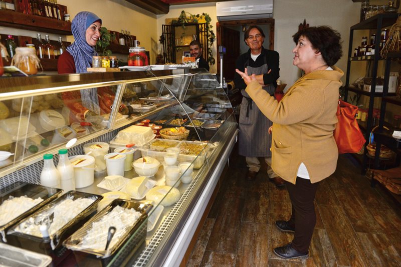 Tamrkhain “Taymour” Shisani and his business partner, Dalal Shoumen, assist a customer in their specialty-cheese shop in Amman. “I like the patience making cheese takes,” he says. “And the precision. If you are two minutes late, it’s all over.”