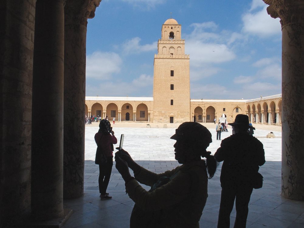 With its hypostyle prayer hall opening to a plaza lined on three sides with shady, arched porticoes, the Great Mosque of Kairouan’s size made it an immediate landmark of piety and power that remains an active house of faith and the city’s most popular visitor attraction.