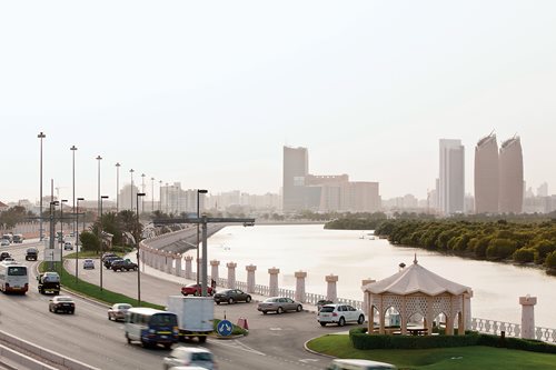 In Abu Dhabi, traffic flows along Al Salam Street next to the Eastern Mangrove National Park showing a delicate interaction between people and nature.