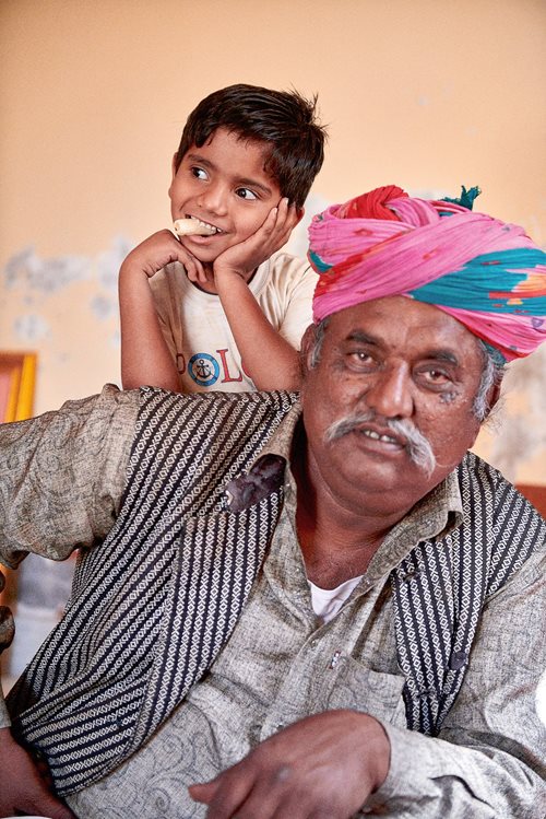 Sakar Khan’s eldest son Ghewar Khan Manganiyar is pictured with his grandson Ayan Khan Manganiyar, 5, who will help carry on the family legacy of music. Like his father, Ghewar performs the kamaicha and Manganiyar music across the globe.