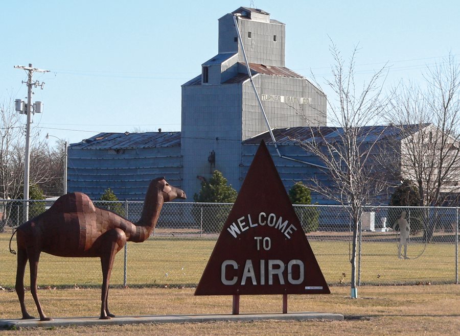 Today the town’s welcome sign echoes its far-away Egyptian origin with a silhouette pyramid and a metal camel sculpture. 