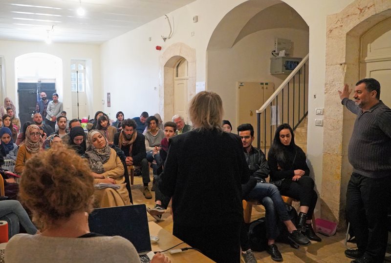 German filmmaker Monica Maurer leads a discussion during a workshop. 