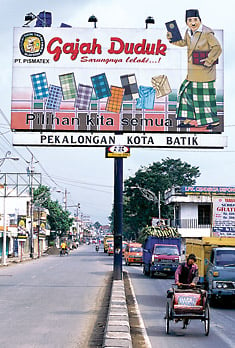 A billboard in Pekalongan advertises Gajah Duduk (“Seated Elephant”) brand sarongs.