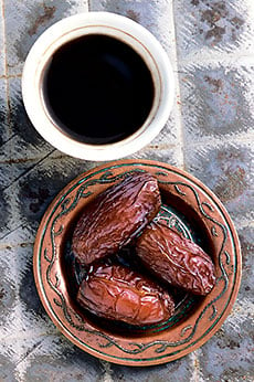 Medjool dates, shown with a demitasse of Turkish coffee, are the number two date crop in the US, and they came to the Coachella Valley from Morocco.