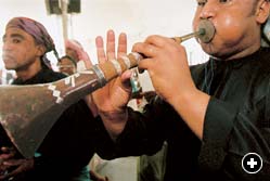 Said Maghrib of the Qurayat ensemble uses circular breathing to play his oboe-like double-reed mizmar.