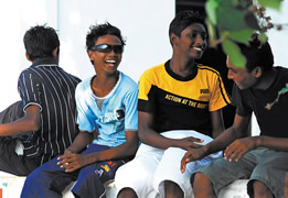 In Meedhoo, refugees from the 2004 tsunami reside in makeshift homes while awaiting completion of permanent homes on Dhuvaafaru, a previously uninhabited island.