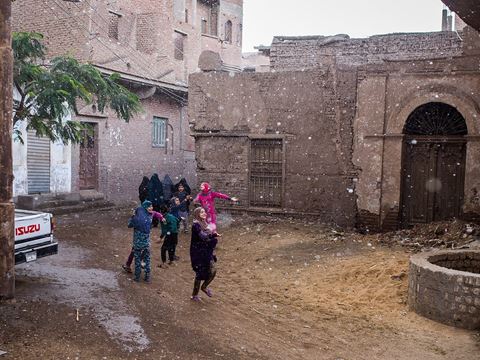 I took this photo during a rainy day in November 2018 from the window of my family home in Fayoum, Egypt, located about 100 kilometers southwest of the capital. It hardly rains but a few times in the year in most parts of Egypt, and when it does, it is always something special, bringing joy and happiness particularly for the local children. —Hesham Elsherif