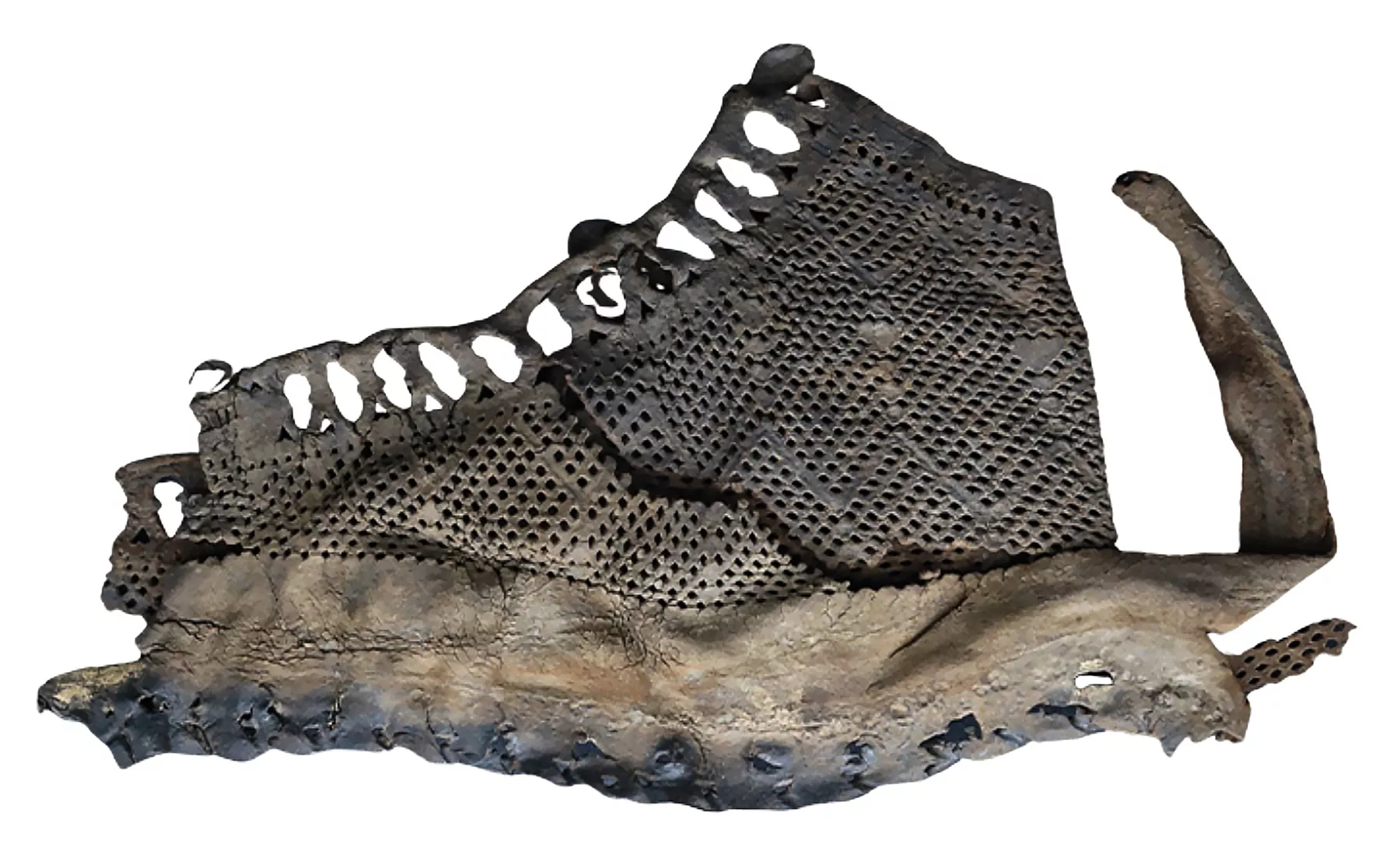 The uppers from this military boot are a style known as “fishnet” because of the many small holes punched into the leather to create a decorative pattern, c. 100-105 CE. Credit Collection of Vindolanda Trust