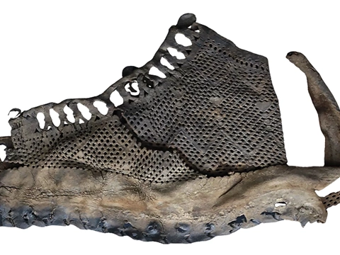 The uppers from this military boot are a style known as “fishnet” because of the many small holes punched into the leather to create a decorative pattern, c. 100-105 CE. Credit Collection of Vindolanda Trust
