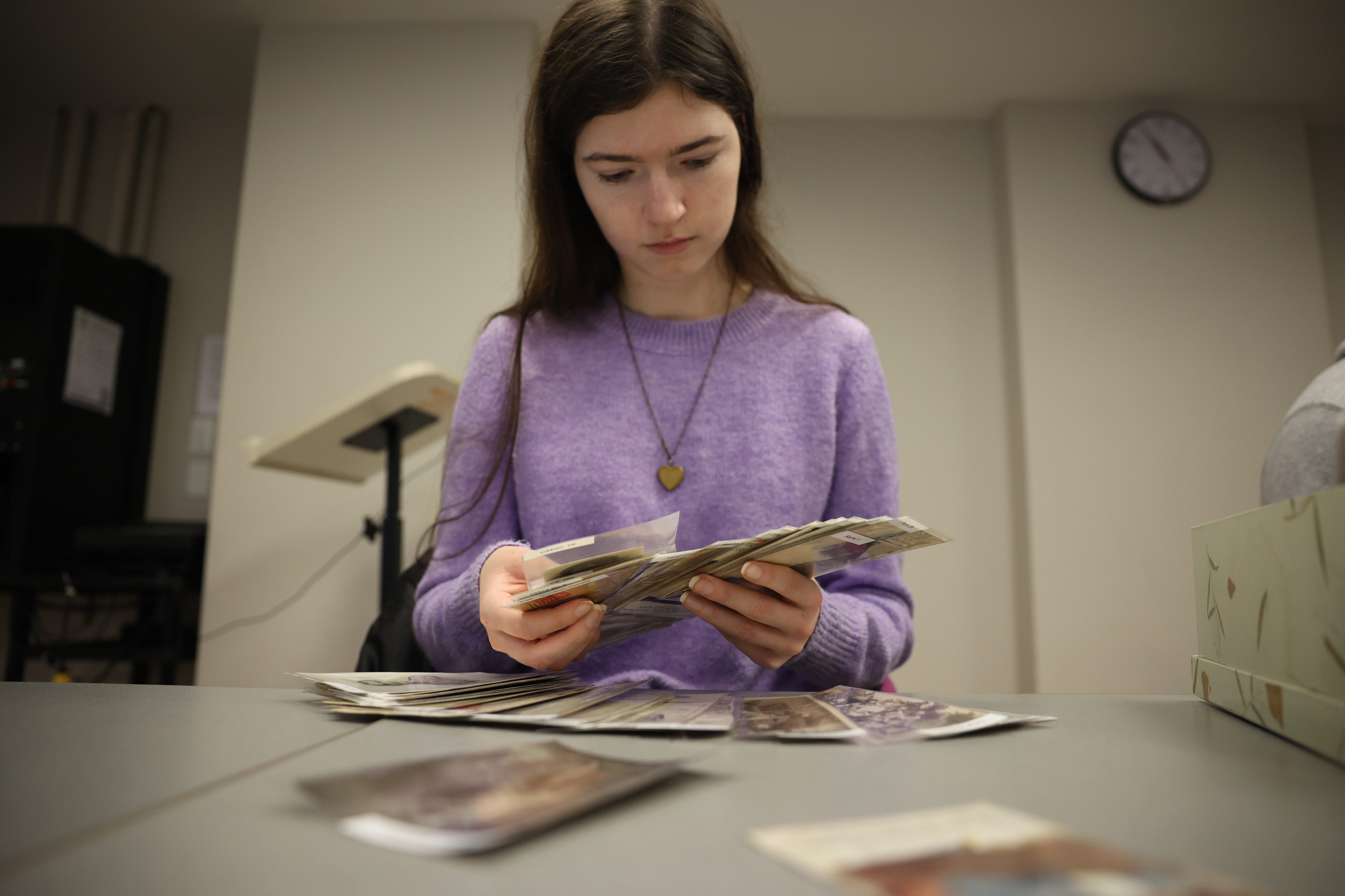 Western University student studies postcards, as a way to carry curiosity into critical thinking skills. 