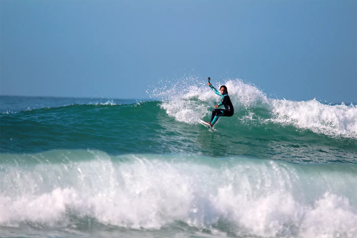 <p>Riding the beach break at &ldquo;K17,&rdquo; which locals call the surf location 17 kilometers north of Agadir, El Gardoum films herself with a GoPro camera. El Gardoum wanted to learn to surf as a young girl and today she is one of the many young Moroccans putting North African surfing on the map.</p>
