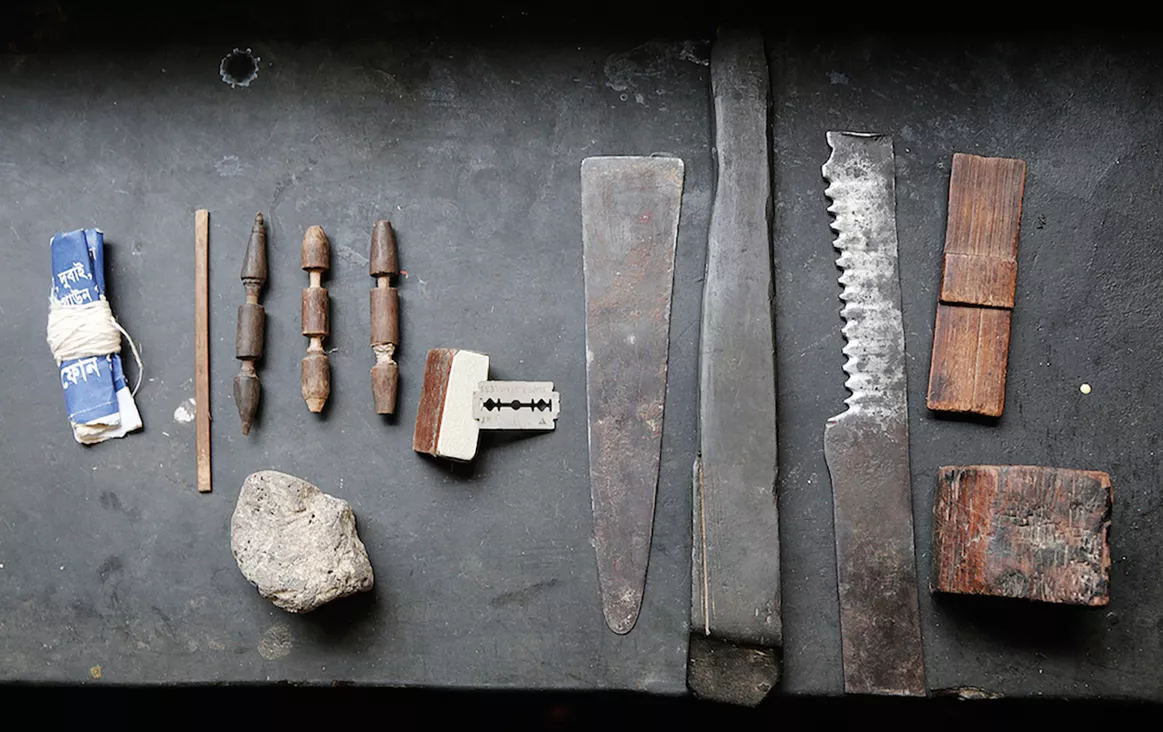 <p>A few of the more than 50 tools used by specialists to make the muslin weaver&rsquo;s <em>shana</em> (ultrafine-toothed reed comb) from a dense bamboo called <em>mahal </em>that allows for the setting of more than 1,000 teeth per meter. On a loom, shanas keep separation among spiderweb-thin warp threads.</p>
