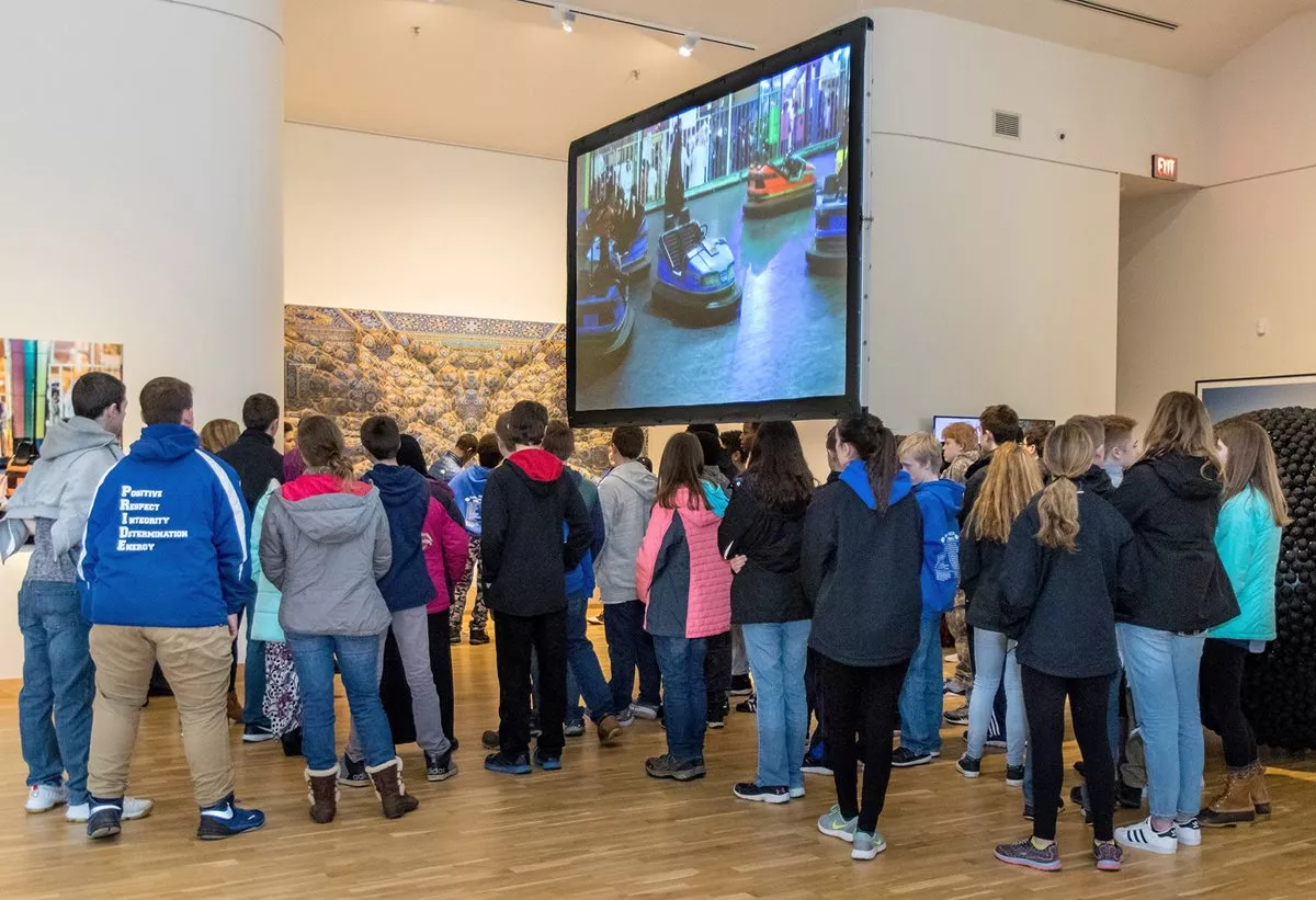 <p align="LEFT" dir="LTR"><span lang="EN">Students watch Arwa Al-Neami&rsquo;s "Never Never Land" video during the "Phantom Punch" exhibit.</span></p>
