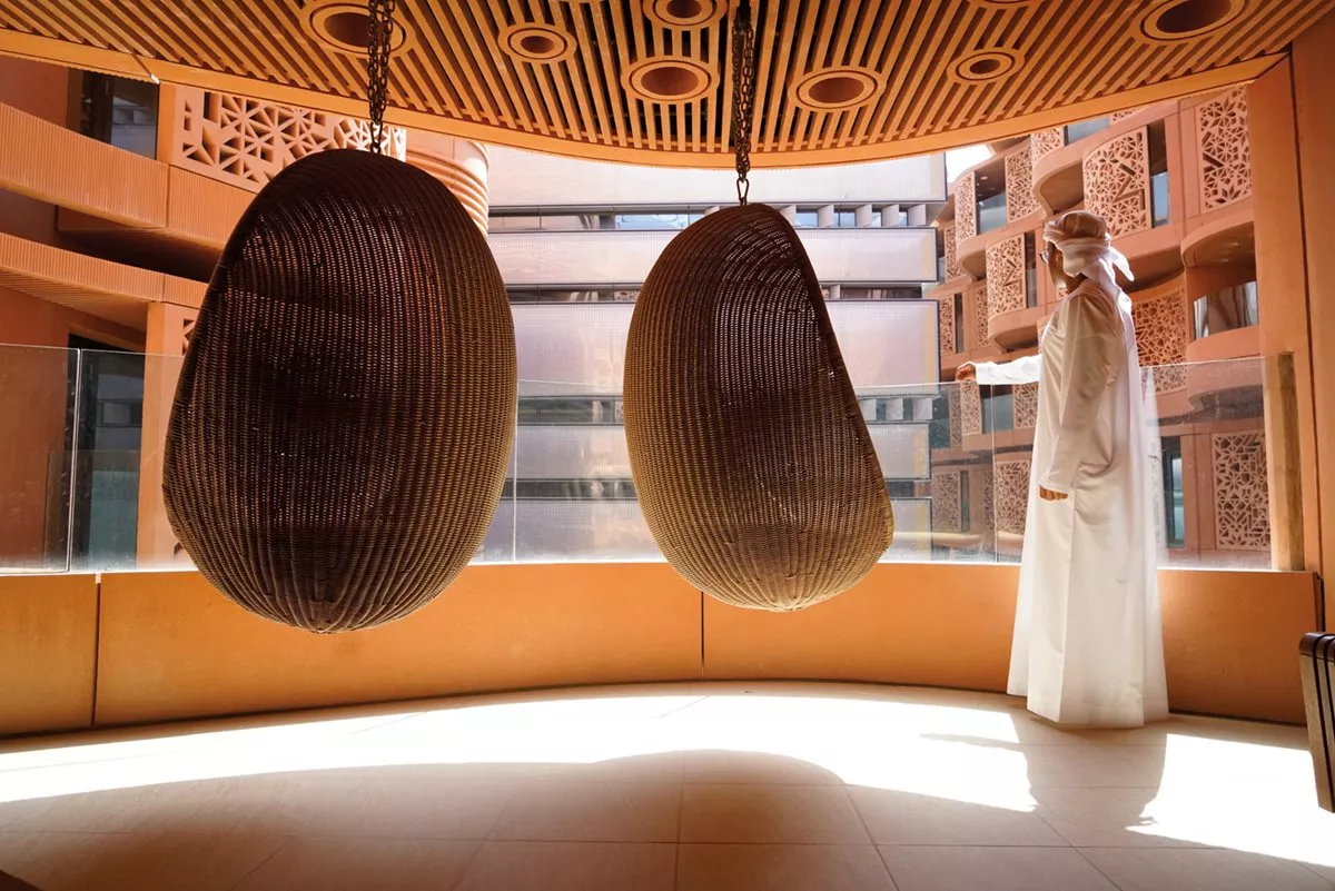 <p>Engineering research assistant Abdulrahman Alzaabi&rsquo;s apartment is shaped by the wavy walls that help move breezes outside.&nbsp;</p>

