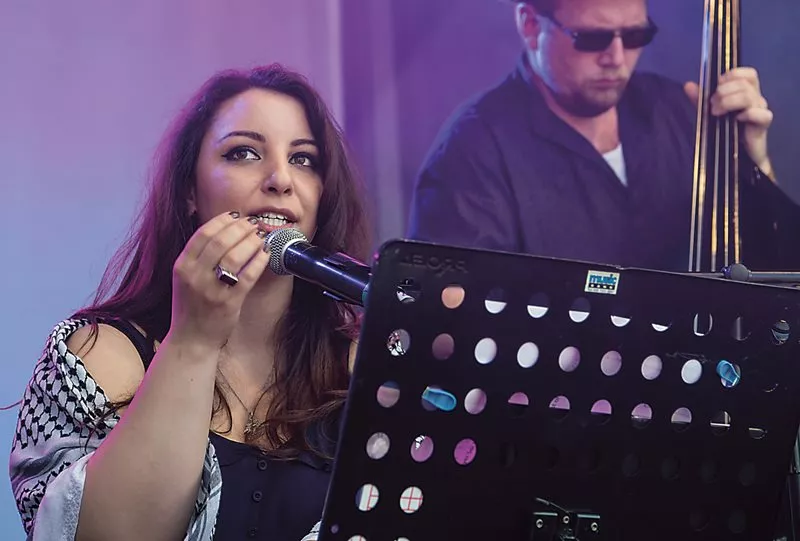 Yara Salahiddeen performs vocals for Oxford Maqam, whose Trafalgar Square set, <em>above</em>, revived songs of 19th- and early 20th-century Egypt, evoking a lively response in the audience. The band&rsquo;s repertoire stems from some of the first recordings ever made in Egypt, on wax cylinders.
