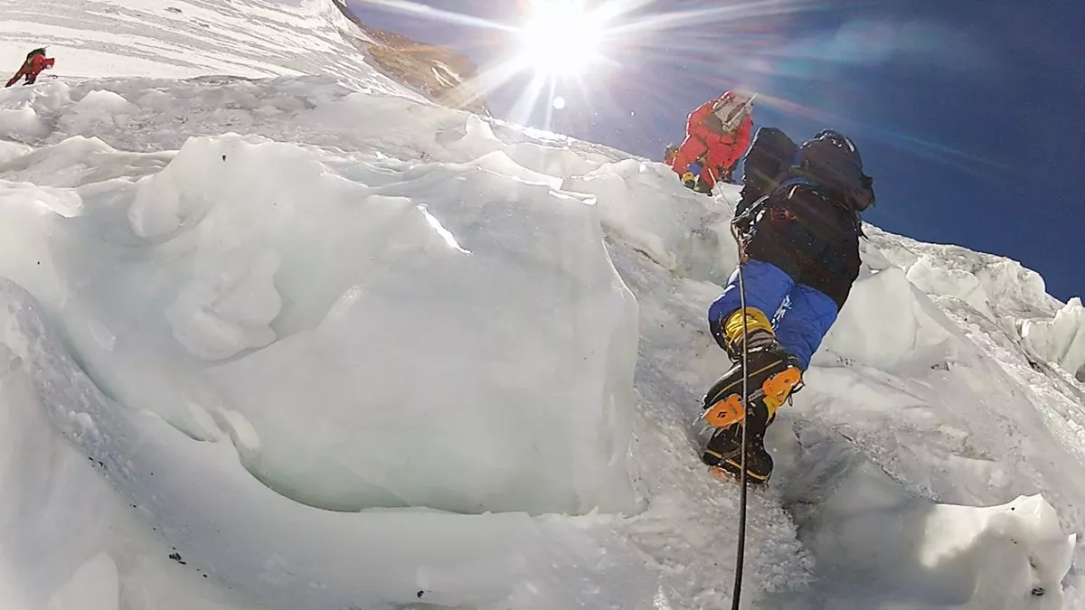 Crampons clamped to her boots help Moharrak and her teammates maintain footing on the route up Mount Everest. Moharrak became one of some 60 women who have reached the summit and, at age 28, one of the youngest.