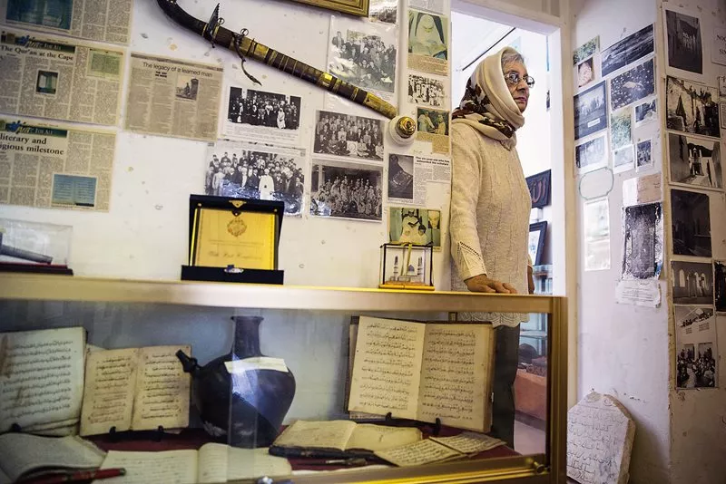 Zainab "Auntie Patty" Davidson, 84, walks through the home she grew up in and in 1998 turned into the Heritage Museum.