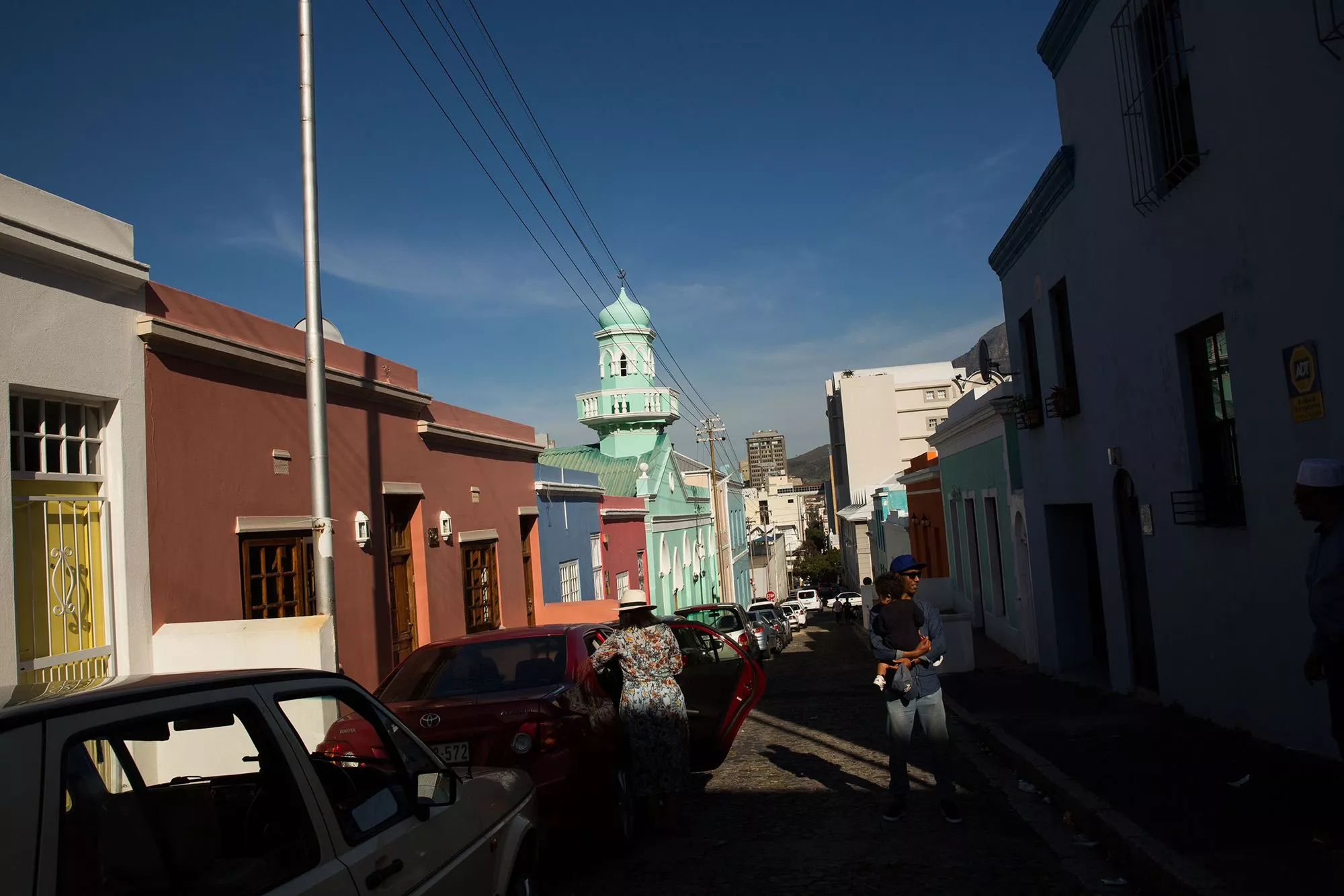 A local landmark and one of many historical buildings in Bo-Kaap, the minaret of the Masjid Boorhaanol Islam rises amid the neighborhood's colorful walls on Longmarket Street. Local leaders, including Minister of Arts and Culture Nathi Mthethwa, are beginning the process of designating Bo-Kaap as a <span class="smallcaps">unesco</span> World Heritage Site.
