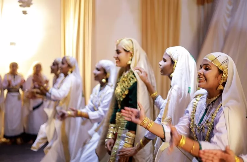 A group of young women perform a wedding song and dance called oppana, (“Clapping together”). 