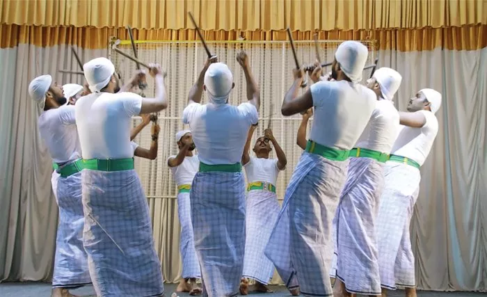 Combining dance with intense percussive rhythms, kolkali (stick dance) involves performers swaying, swinging and interweaving while clacking heavy sticks in complex musical patterns.