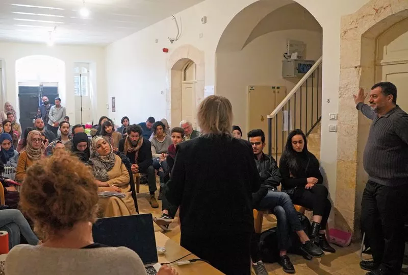 German filmmaker Monica Maurer leads a discussion during a workshop. 