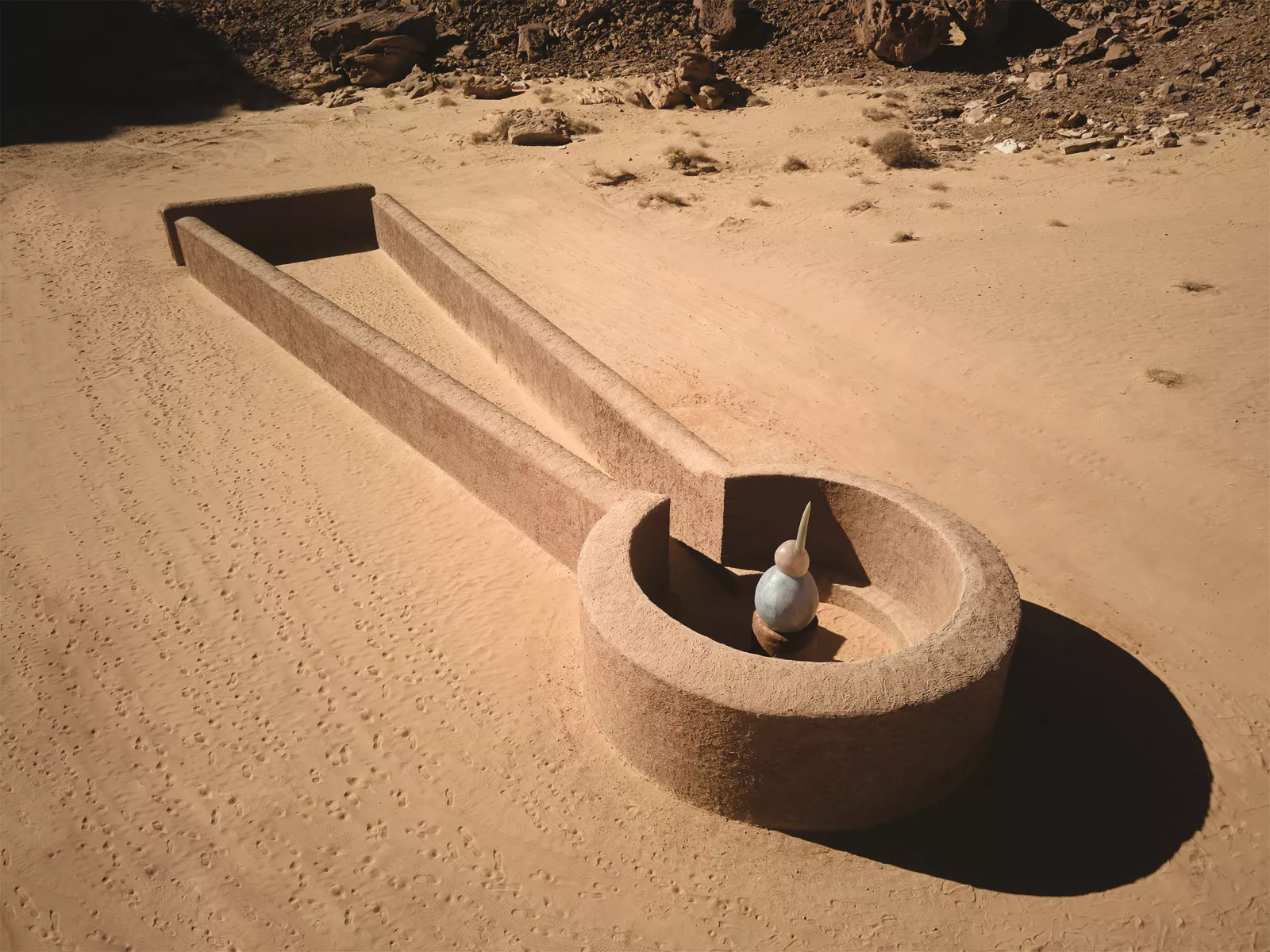 Saudi artist Sultan bin Fahad looked to the region’s distant past in his construction of an abstract, sculptural kite, so called by archeologists who have discovered remains of hundreds of such constructions throughout the northwestern Arabian Peninsula and beyond. Dating from Neolithic and even earlier periods, kites are believed to have been hunting traps: Sometimes more than 100 meters on a side, they helped hunters drive game into and down the top “wedge” and, once their prey entered the circular corral, the hunters could use spears.