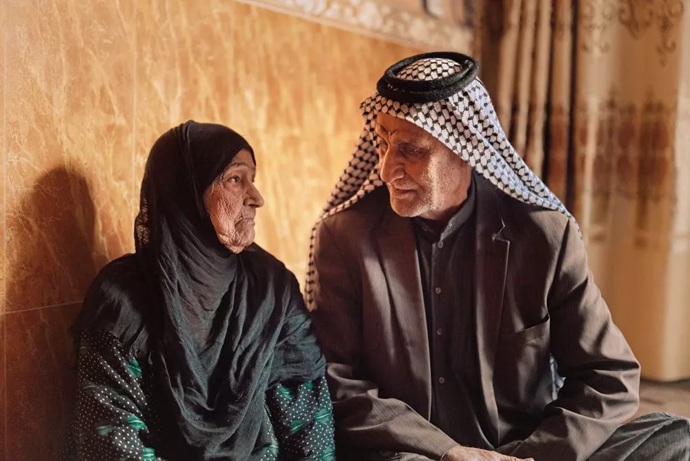 Khashiyeh Shamekh Nikhash and Bin Thuqub married in late 1958, the last year Bin Thuqub worked with Thesiger. She remembers, “when Amara set his eyes on me, I knew he wanted me.” The couple now lives with their daughter Amal and granddaughter Rusulin in a modest, two-story house in Shu‘ala, a district at the northeast edge of Baghdad. 