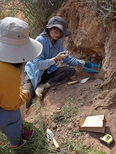 Collecting samples, Basira Mir-Makhamad digs in a settlement in Juuku, Kyrgyzstan. 