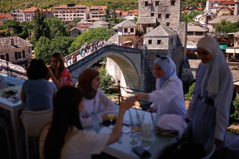 The Old Bridge offers a picturesque backdrop for patrons at coffeehouses and shops in Mostar.