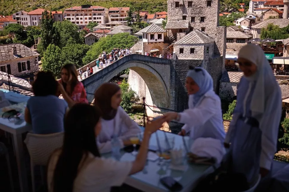 The Old Bridge offers a picturesque backdrop for patrons at coffeehouses and shops in Mostar.