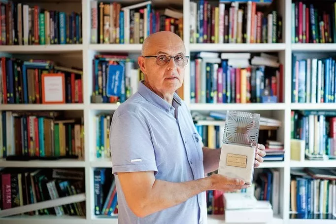 Architect Tihomir Rozić, who was a member of the Old Town Mostar conservation project, holds the Aga Khan Award given to the team in 1986.