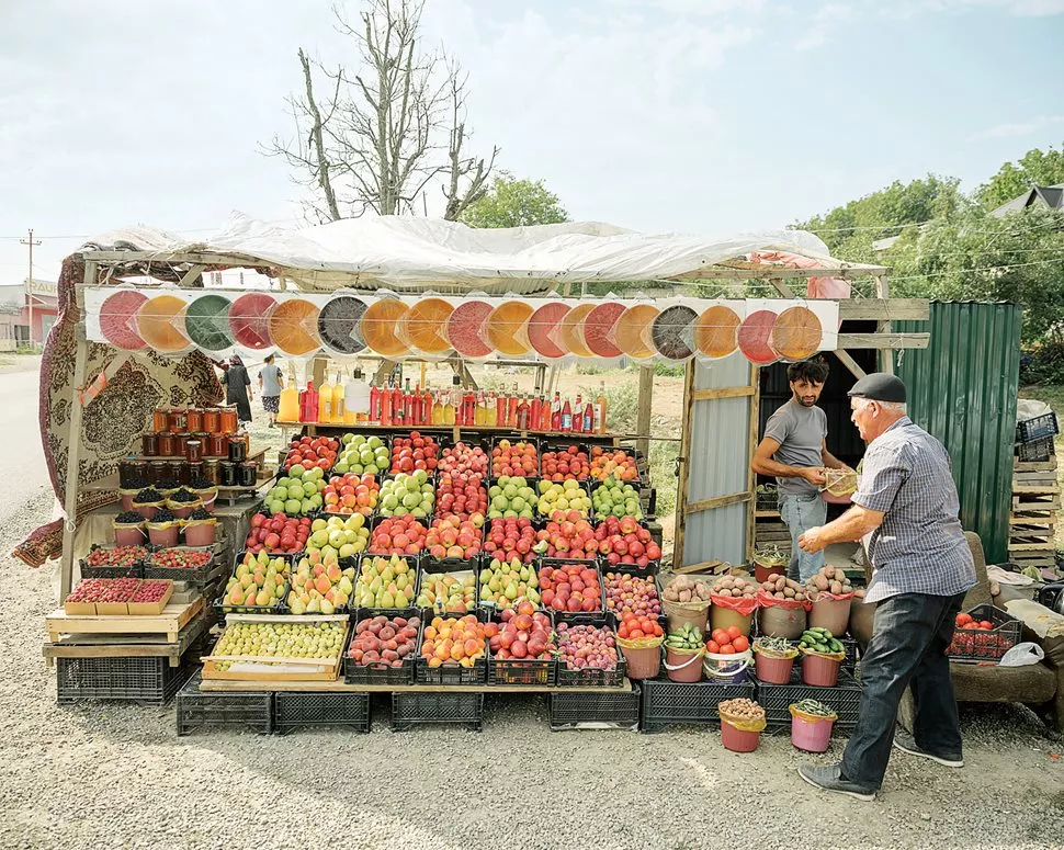 Fresh fruits and vegetables overflow from markets like this one outside Qusar. 