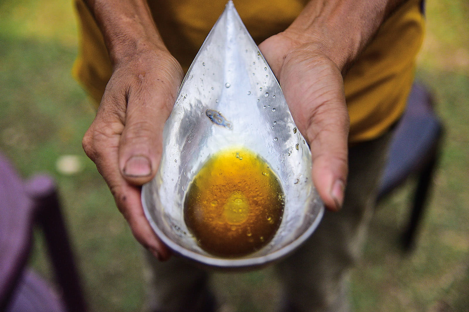 Six grams (a half-tola) of Cambodian oud oil is poured into the bottle that a customer purchased at an Ibraheem Al Qurashi Company store in al-Khobar, Saudi Arabia. (Photo by Anuwar Hazarika/NurPhoto via Getty Images)
