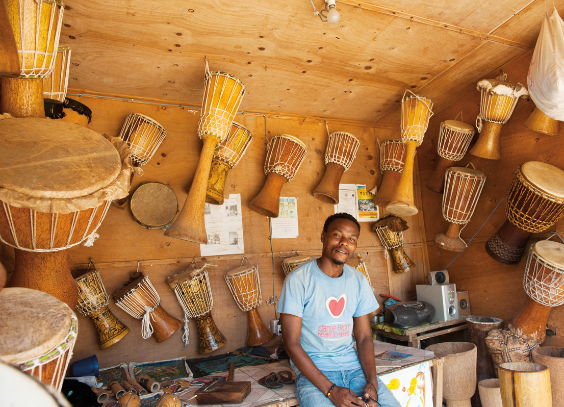 A musician himself, Abu Juma sells drums both to fellow Bagamoyo musicians and tourists. Posing with 10 of the children they care for at The Baobab Home, Terri Place and Caito Mwandu also run health groups for families and children.&nbsp;
