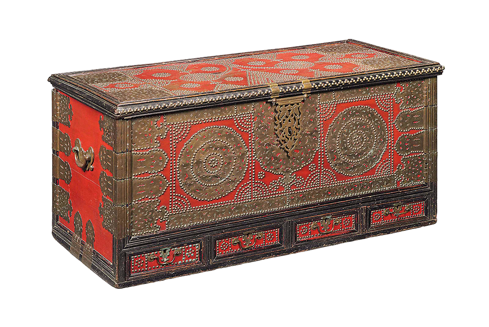 <p>Red paint under brass studs and appliqué plates of this 19th-century “Zanzibar” chest indicates that it likely was used for a dowry.</p>