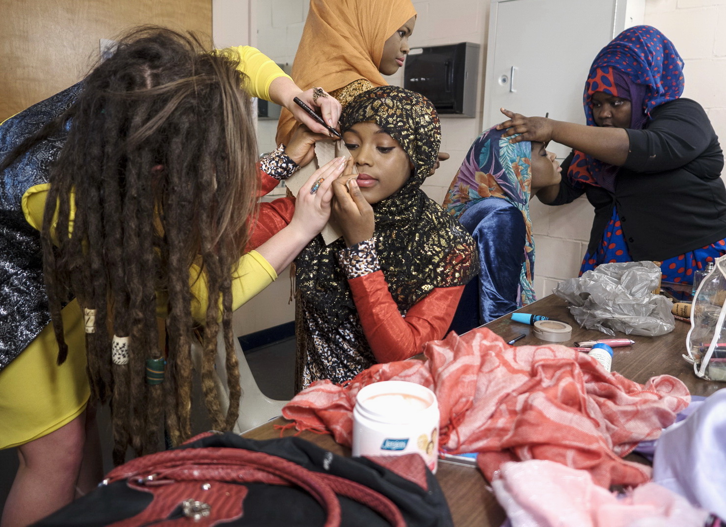 Wearing Hassan&rsquo;s designs, models prep for the runway. &ldquo;I decided to create fashions appropriate to my culture and to my beliefs,&rdquo; Hassan says, &ldquo;but also unique and sophisticated&sbquo; so that both Muslim and non-Muslim women would want to wear it.&rdquo;