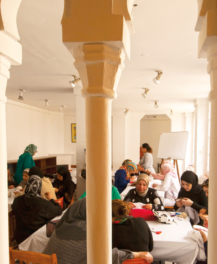 Women gather in an embroidery class.