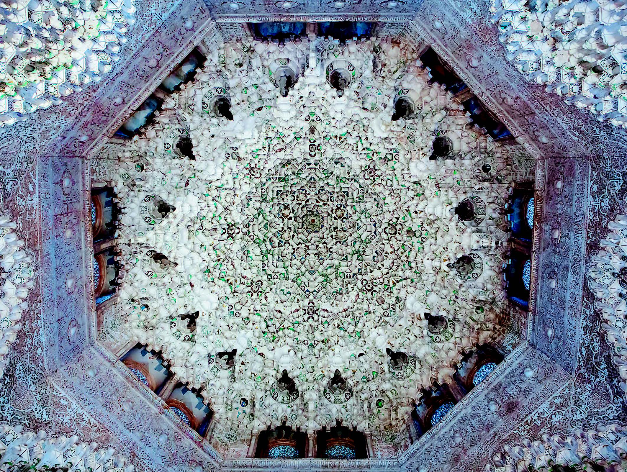 GRANADA, SPAIN: ALHAMBRA, HALL OF THE TWO SISTERS This octagonal muqarnas ceiling contains 5,416 plaster elements, many of which bear traces of their original paint, gold and silver decoration. A poem in Arabic by the 14th-century Nasrid court poet Ibn Zamrak inscribed on the walls below translates: “In the cupola such splendor does the chamber acquire that the palace competes with the very firmament.”