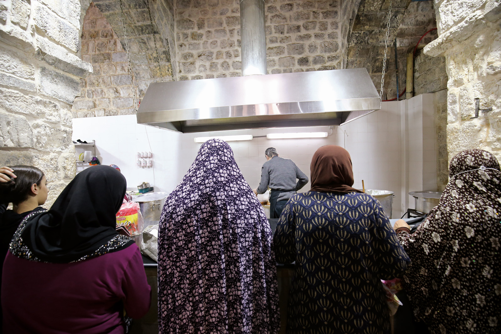 Five Centuries of Jerusalem Soup - women assist in the soup prep