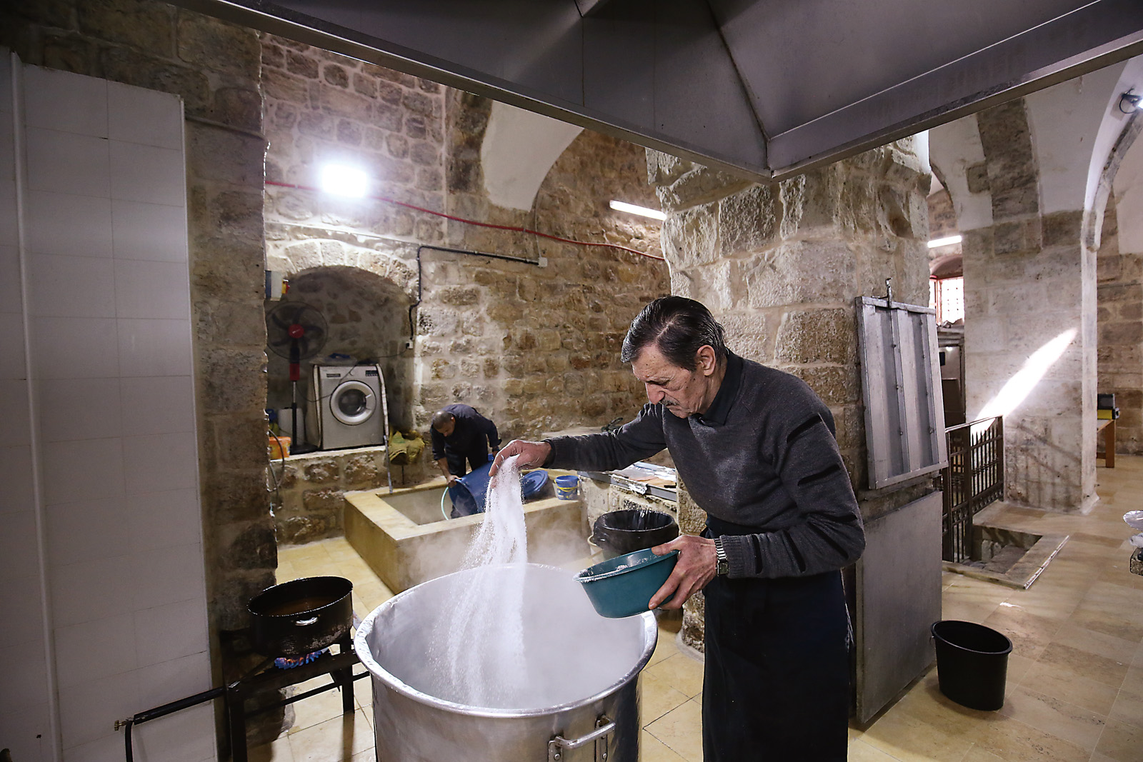 Head cook Samir Jaber prepares the day’s soup beginning at 6 a.m. On this day, it’s yakhni bazela, pea stew. Most recipes take three to four hours to prepare and require 50 to 70 kilograms of varying combinations of rice, vegetables, mutton, and beef or chicken.