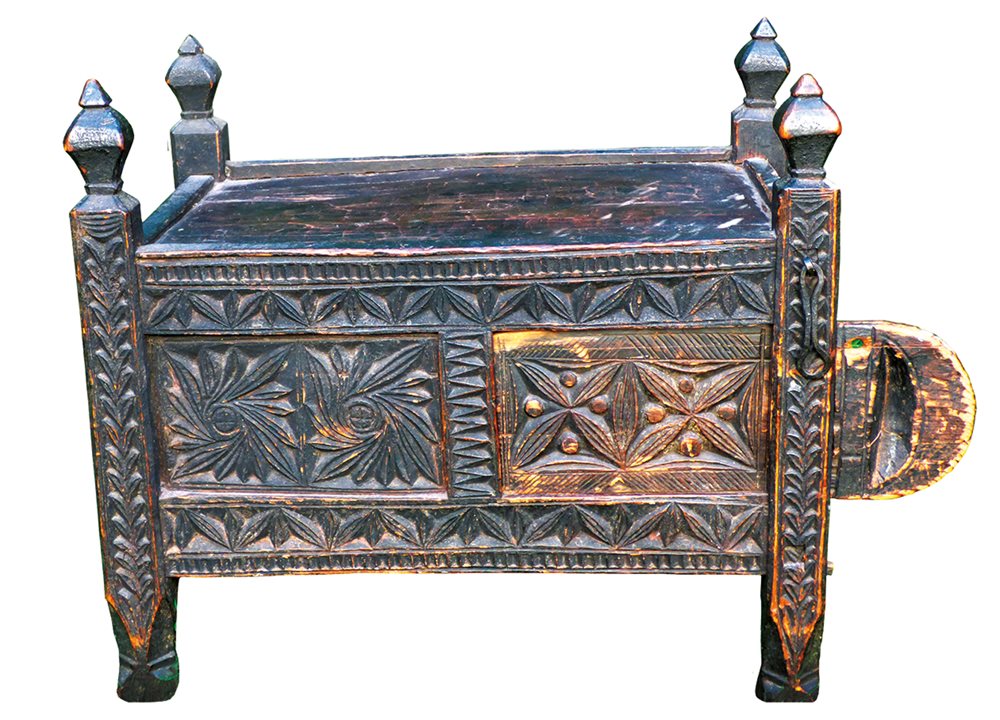 <p>From the Dir Valley in northern Pakistan, this chest is carved from Himalayan cedar. Its pieces are joined, not nailed. Its legs are part of its design, and their rise above the lid is characteristic of the region&rsquo;s style. The wooden tab on the right is used to pull open a front panel.</p>