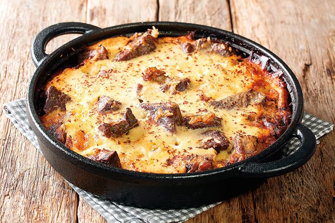 A version of Tavë kosi—baked lamb and yogurt with rice, seasoned with oregano and garlic—is eaten throughout the Mediterranean, but the casserole originated in Elbasan, Albania.