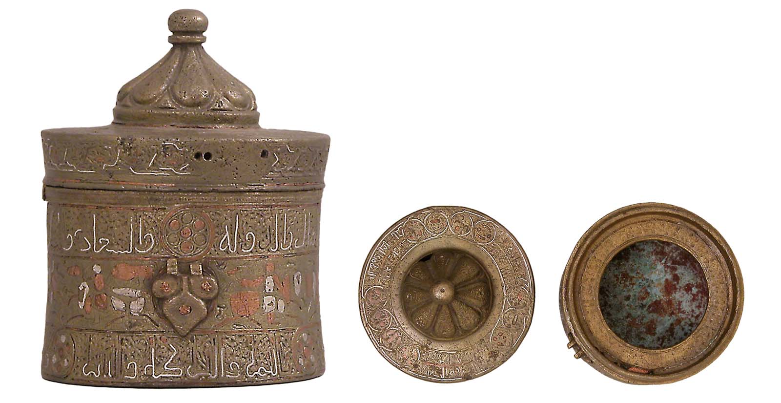 The open grooves of this 12th-century bronze-cast vessel once held inlaid silver and copper. It was most likely an inkwell, and the Arabic inscriptions on the upper and lower bands offer praises and good wishes to its owner.
