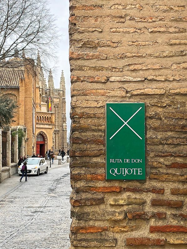 A sign on a wall in Toledo indicates a point of interest along La Ruta de Don Quijote, which has been developed as a cultural tourism project linking nearly 150 municipalities and sites over 2,500 kilometers of historic roads throughout Castile-La Mancha.