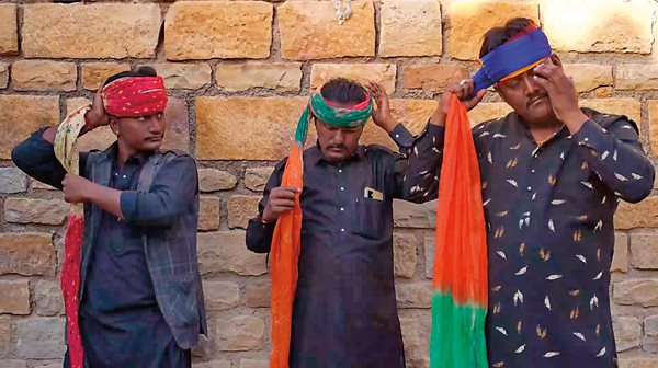 Barmer Boys, from left, Magada Khan, Manga Khan and Sawai Khan, prepare to perform near Gadisar Lake in Jaisalmer, Rajasthan. The group has performed more than 200 concerts in 20 countries highlighting their Rajasthani folk and Sufi music. 